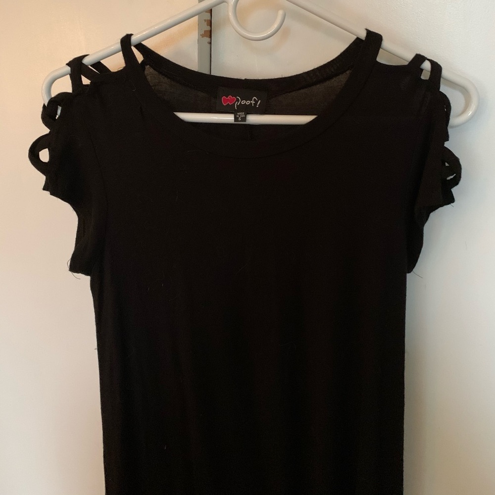 Black tshirt dress. Cut out patterned shoulders.